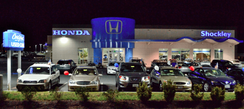 Shockley Honda dealership and children in the back of a truck