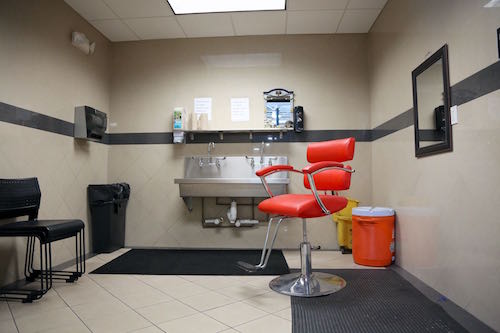Photos of the Toyota North Miami facilities, including the showroom, a barber chair and gym.