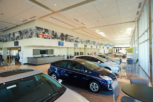 Photos of the Toyota North Miami facilities, including the showroom, a barber chair and gym.